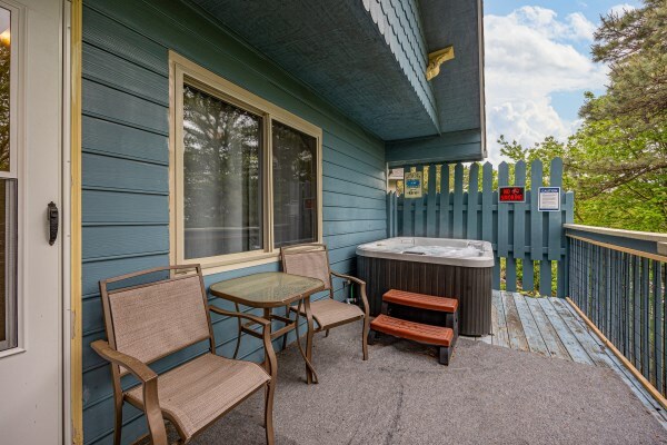 exterior space with central air condition unit and a hot tub