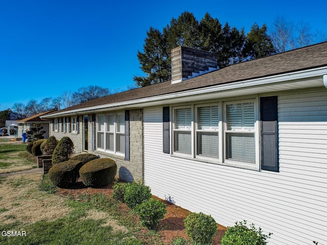 view of home's exterior featuring a lawn