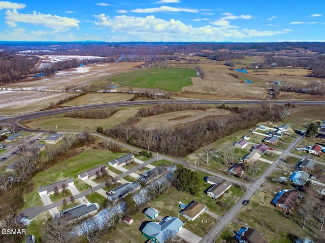 birds eye view of property featuring a rural view