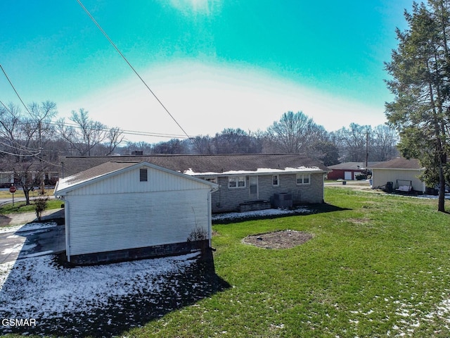 back of property featuring a lawn