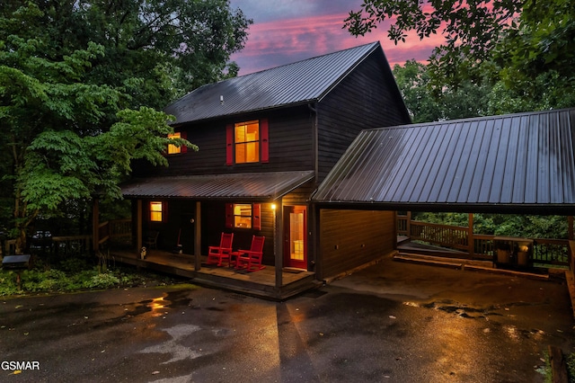 view of back house at dusk