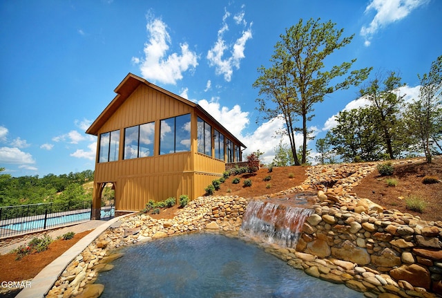 2326 Top Of The World Dr, Sevierville, TN 37876 - view of home's exterior featuring a sunroom and a patio area