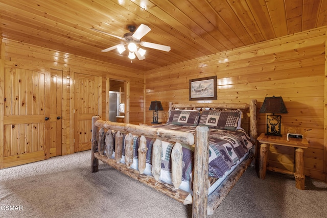 2326 Top Of The World Dr, Sevierville, TN 37876 - carpeted bedroom with wood ceiling, wood walls, and ceiling fan