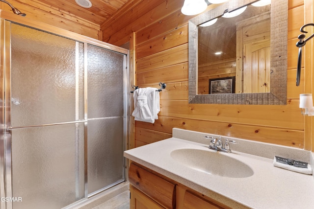 2326 Top Of The World Dr, Sevierville, TN 37876 - full bath featuring wooden walls, a stall shower, and vanity