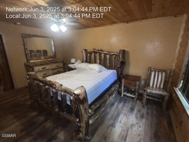 414 Swaying Pines Dr, Sevierville, TN 37876 - bedroom with dark wood-type flooring and wooden ceiling