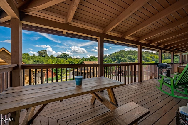 deck with outdoor dining area