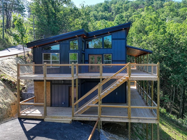 back of house with a wooden deck