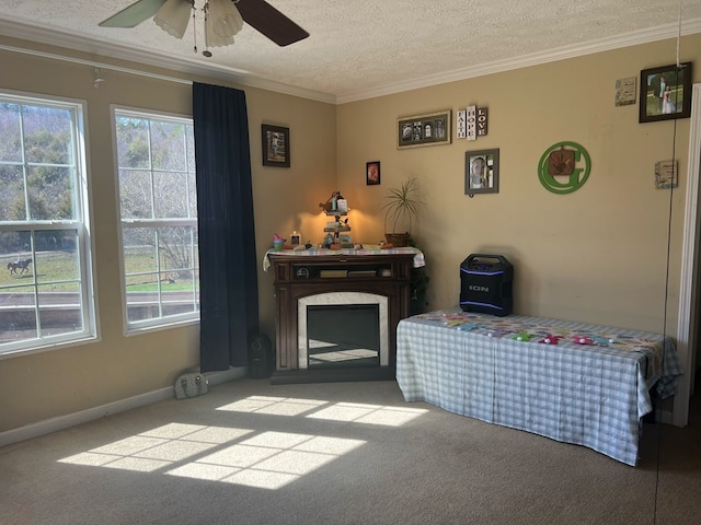 carpeted living room with a textured ceiling, crown molding, ceiling fan, and a healthy amount of sunlight