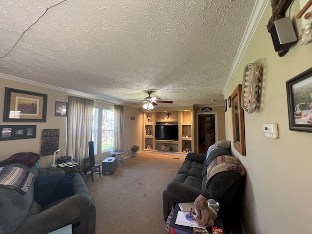 living room featuring a textured ceiling, ceiling fan, carpet flooring, and crown molding