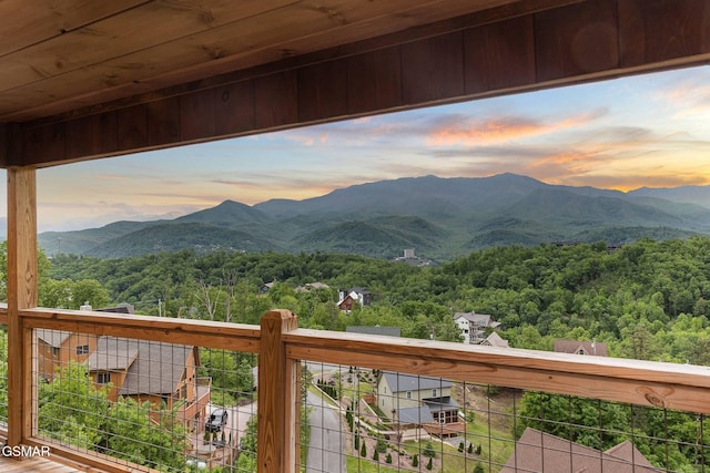 view of mountain feature featuring a forest view