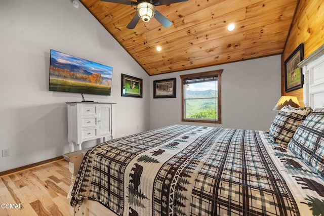 bedroom with wood finished floors, baseboards, lofted ceiling, ceiling fan, and wood ceiling