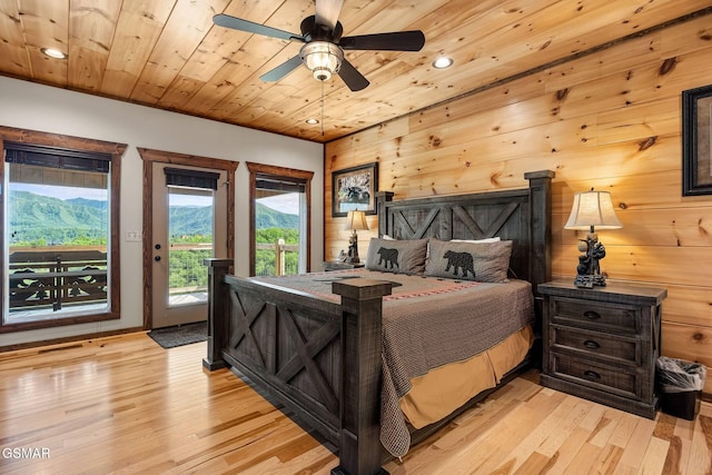 bedroom featuring recessed lighting, light wood-style flooring, wooden ceiling, and access to outside