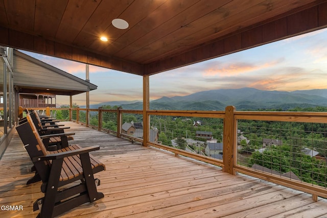 deck at dusk with a mountain view