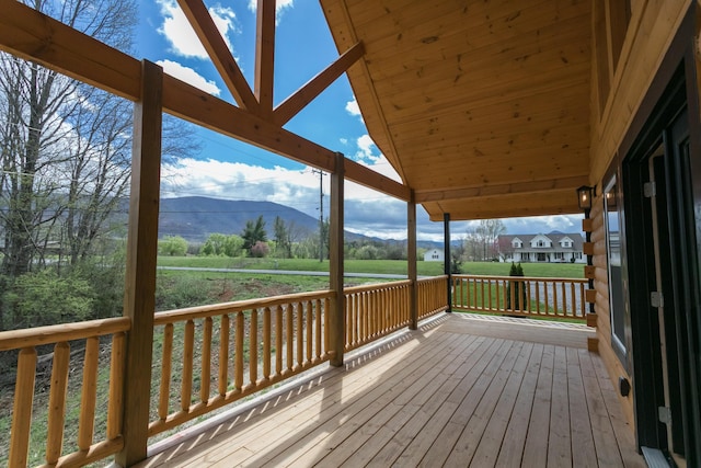 wooden deck featuring a mountain view