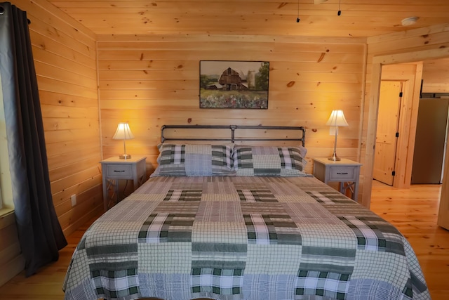 bedroom with wood walls