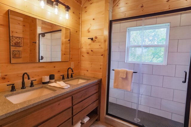 bathroom with wooden walls, vanity, and a shower with shower door