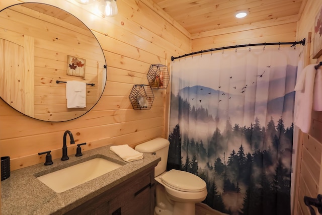 bathroom featuring vanity, toilet, wood ceiling, and wooden walls