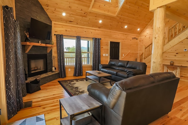 living area with wood ceiling, lofted ceiling, wooden walls, and hardwood / wood-style floors