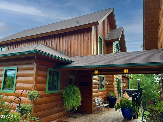 1642 Little Cove Rd, Sevierville, TN 37862 - back of property featuring a deck and roof with shingles