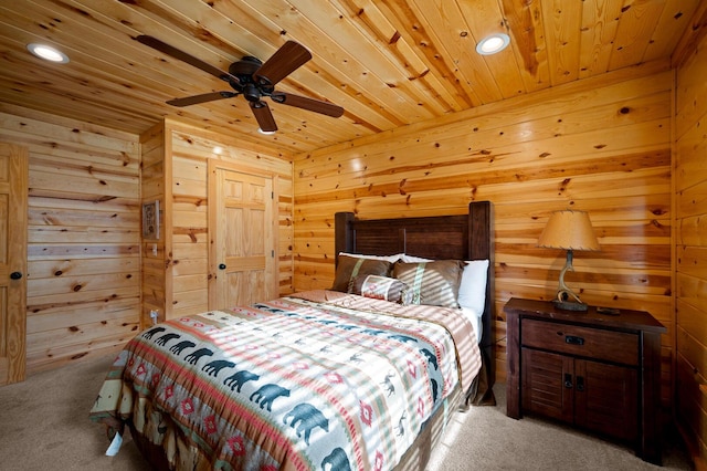 bedroom featuring carpet flooring, wood ceiling, and wood walls