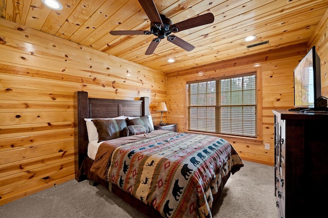 carpeted bedroom featuring recessed lighting, wood ceiling, visible vents, and wood walls