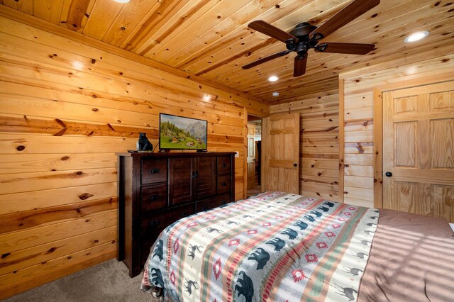 carpeted bedroom featuring wood ceiling and wood walls