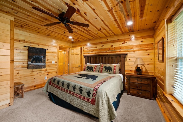 carpeted bedroom with wooden ceiling, wooden walls, and recessed lighting