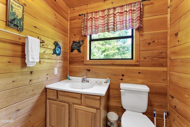 1926 Bird Hill Rd, Sevierville, TN 37876 - bathroom with toilet, vanity, and wood walls