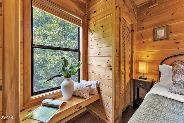 1926 Bird Hill Rd, Sevierville, TN 37876 - bedroom with wooden walls and wood finished floors