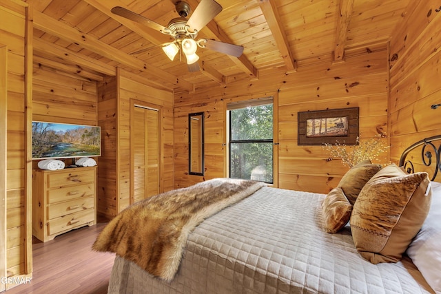 1926 Bird Hill Rd, Sevierville, TN 37876 - bedroom featuring wooden walls, wood ceiling, beamed ceiling, and wood finished floors