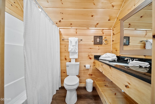 2939 Fiddlers Creek Way, Pigeon Forge, TN 37863 - full bath with toilet, wood finished floors, vanity, wood walls, and shower / bath combo