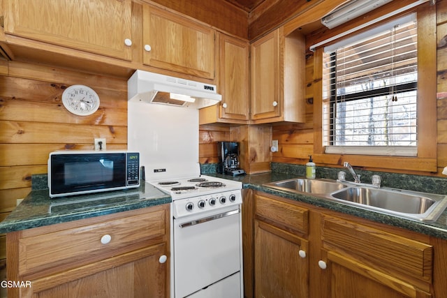 kitchen featuring dark countertops, white electric range, wood walls, black microwave, and under cabinet range hood