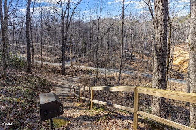 view of yard with a forest view