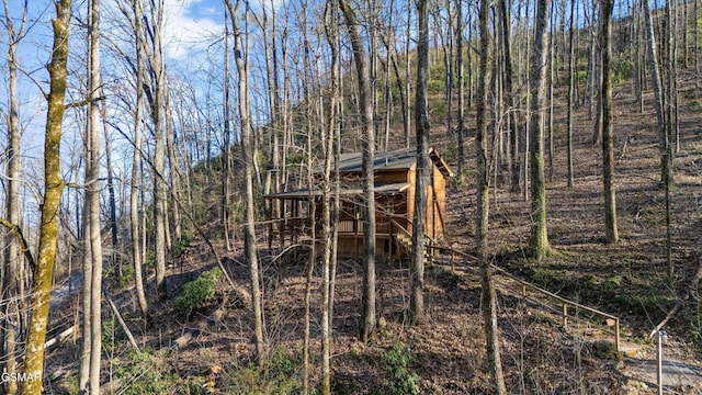 exterior space with a forest view