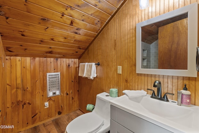 bathroom featuring heating unit, toilet, wood ceiling, vaulted ceiling, and vanity