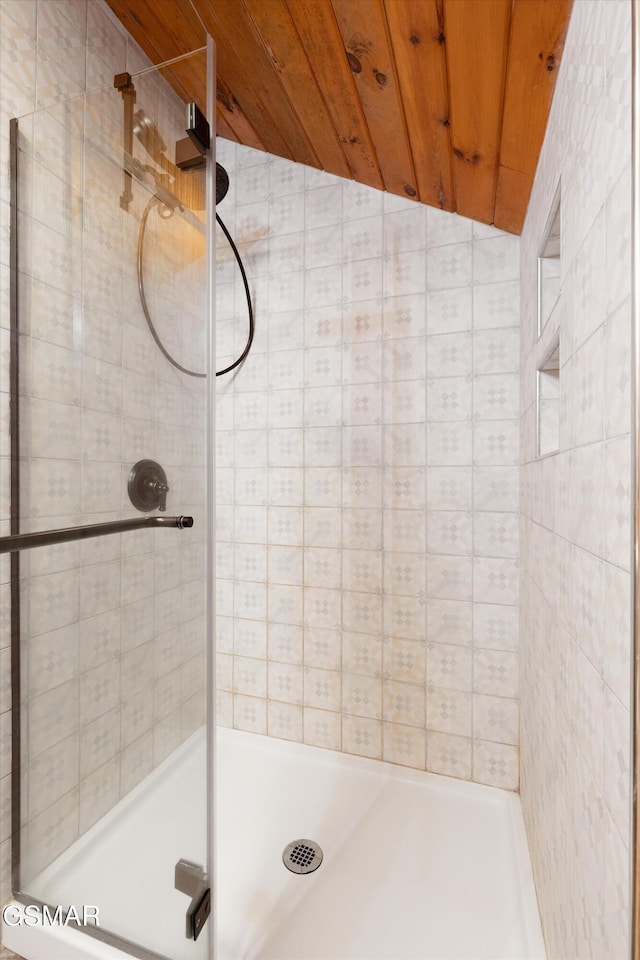 full bathroom with wooden ceiling, a stall shower, and lofted ceiling