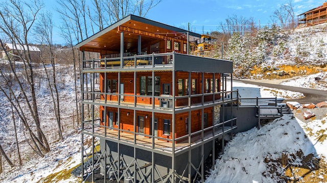 snow covered house with a balcony