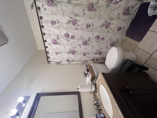 half bathroom featuring toilet