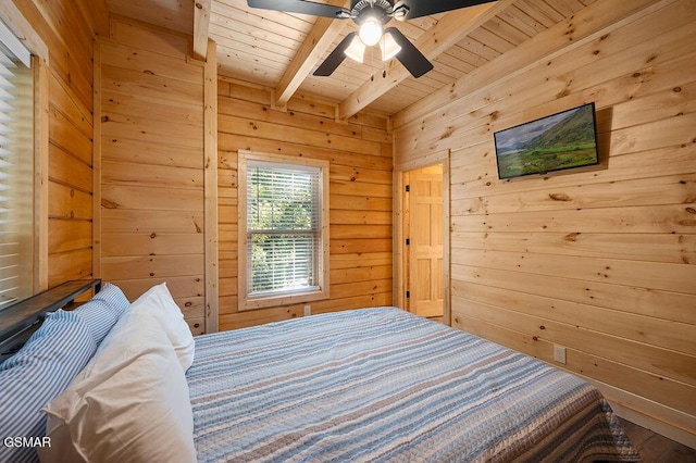 bedroom featuring wooden walls, beamed ceiling, and wooden ceiling