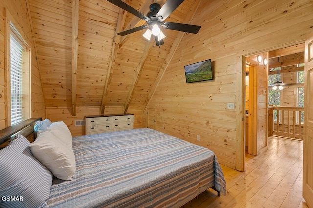 bedroom with lofted ceiling with beams, wood walls, wood ceiling, and light wood-type flooring