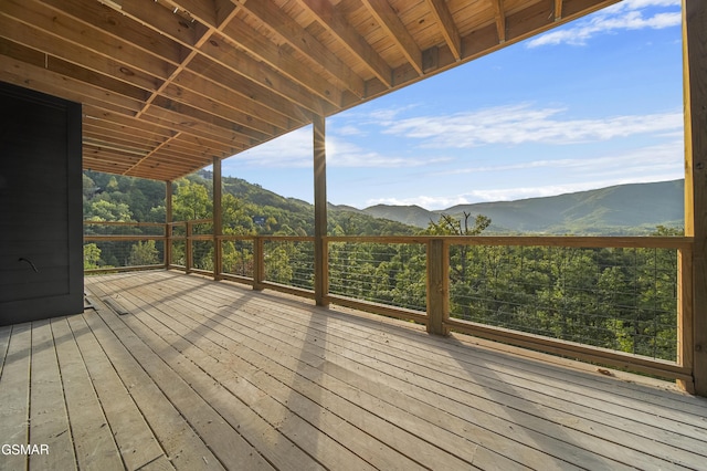 wooden deck with a mountain view