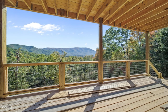 wooden deck with a mountain view