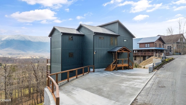 chalet / cabin featuring metal roof and a mountain view