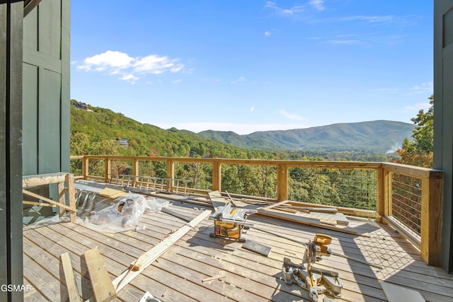 wooden terrace featuring a mountain view