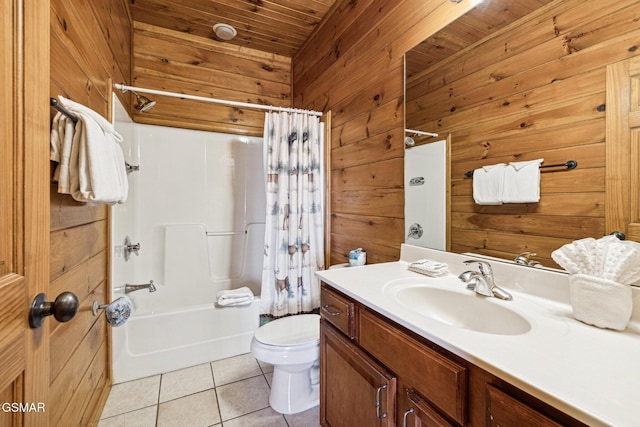 full bathroom with toilet, vanity, tile patterned floors, shower / tub combo, and wooden walls