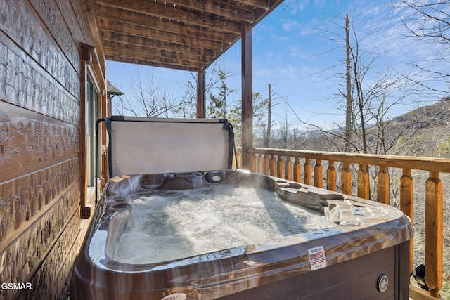 deck with a hot tub