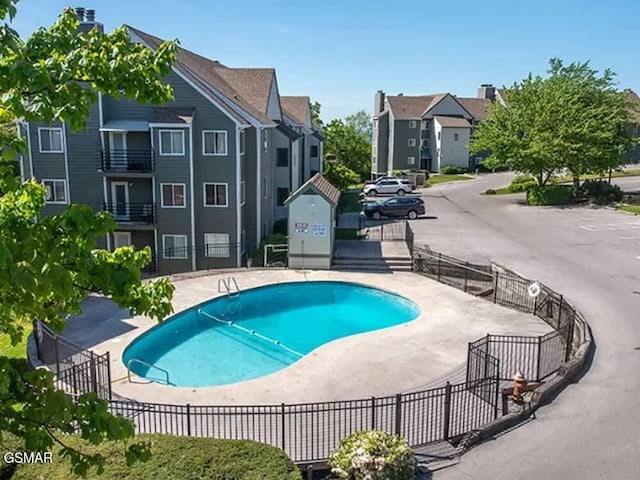 view of swimming pool featuring a patio area