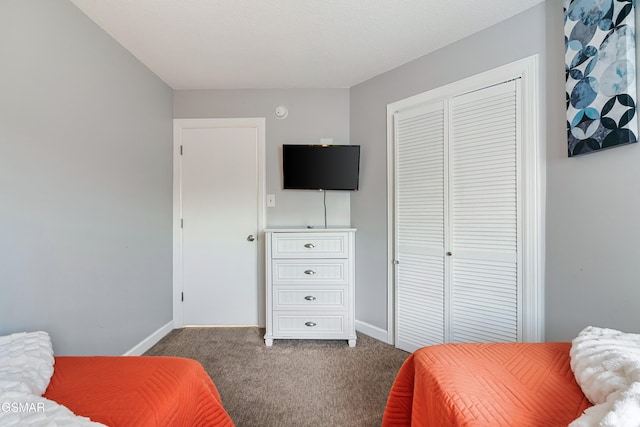 carpeted bedroom with a closet