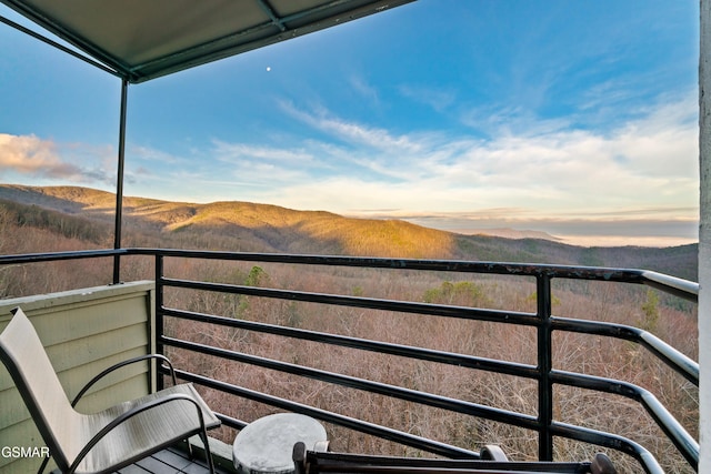 balcony at dusk with a mountain view