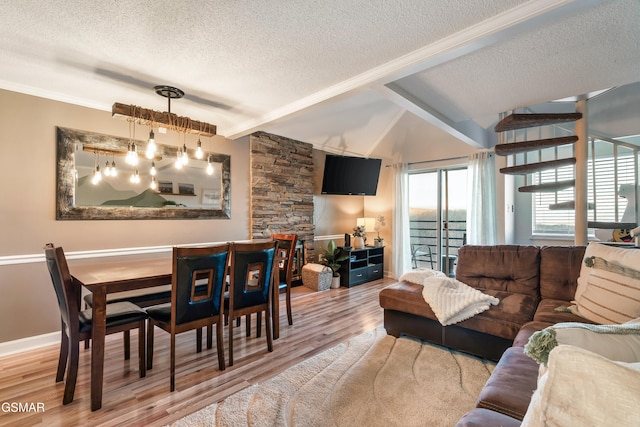 living room with vaulted ceiling with beams, a textured ceiling, and hardwood / wood-style flooring